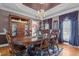 Elegant dining room with chandelier, ample seating, and beautiful china cabinet at 1055 Tilghman Rd, Dunn, NC 28334