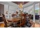Elegant dining room with ample seating and decorative chandelier at 1055 Tilghman Rd, Dunn, NC 28334