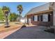 Back of house with fountain, palm trees and brick design at 1055 Tilghman Rd, Dunn, NC 28334