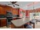 The kitchen features a breakfast bar, stainless steel appliances, and a view to the breakfast nook at 1055 Tilghman Rd, Dunn, NC 28334