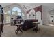 Bright living room with tall windows, fireplace, and comfortable seating area at 1055 Tilghman Rd, Dunn, NC 28334