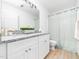 Bathroom vanity with granite countertops, dual sinks, and a shower at 106 Mingocrest Dr, Knightdale, NC 27545
