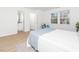 Bedroom with view to bathroom featuring a queen bed, hardwood floors, and natural light at 106 Mingocrest Dr, Knightdale, NC 27545