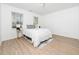 Bright bedroom featuring a queen bed, hardwood floors, and natural light at 106 Mingocrest Dr, Knightdale, NC 27545