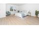 Bedroom featuring a queen bed, hardwood floors, and natural light at 106 Mingocrest Dr, Knightdale, NC 27545