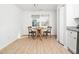 Bright dining area with hardwood floors and a round wooden table at 106 Mingocrest Dr, Knightdale, NC 27545
