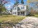 Charming two-story home with a well-maintained lawn, concrete driveway, and a quaint front porch at 106 Mingocrest Dr, Knightdale, NC 27545