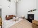 Inviting living room with high ceilings, a cozy fireplace, hardwood floors, and staircase access at 106 Mingocrest Dr, Knightdale, NC 27545
