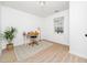 Home office with a desk, hardwood floors, and a large window at 106 Mingocrest Dr, Knightdale, NC 27545