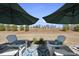 Cozy back patio featuring comfortable Adirondack chairs and outdoor decor at 1113 Cryptic Wood Ave, Fuquay Varina, NC 27526