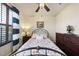 Cozy bedroom features a floral quilt, wood furniture, and shuttered window at 1113 Cryptic Wood Ave, Fuquay Varina, NC 27526