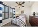 Comfortable bedroom with dark wood shutters, a ceiling fan, and a cozy atmosphere at 1113 Cryptic Wood Ave, Fuquay Varina, NC 27526