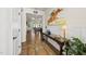 Elegant entryway with hardwood floors, a decorative table, and a painting that creates a welcoming atmosphere at 1113 Cryptic Wood Ave, Fuquay Varina, NC 27526