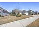 Street view of a home with a well-maintained lawn and beautiful landscaping in a suburban neighborhood at 1113 Cryptic Wood Ave, Fuquay Varina, NC 27526