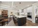 Well-appointed kitchen with a spacious island, modern lighting, and barstool seating at 1113 Cryptic Wood Ave, Fuquay Varina, NC 27526