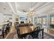 Inviting living and dining area with an open floor plan and stylish furnishings at 1113 Cryptic Wood Ave, Fuquay Varina, NC 27526