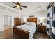 Lovely bedroom showcasing hardwood floors, a ceiling fan, and ample space for comfortable living at 1113 Cryptic Wood Ave, Fuquay Varina, NC 27526