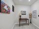 The office features wood-look tile, neutral paint, and quirky wall art at 1113 Cryptic Wood Ave, Fuquay Varina, NC 27526