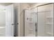 Clean bathroom features a glass shower and white fixtures at 1113 Ursa Major Ct, Wendell, NC 27591