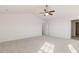 Spacious bedroom with plush carpet and ceiling fan at 1113 Ursa Major Ct, Wendell, NC 27591