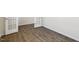 A bright room showcases beautiful floors with an open doorway leading to another room at 1113 Ursa Major Ct, Wendell, NC 27591