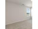 A well lit bedroom with plush carpeting and a bright window at 1113 Ursa Major Ct, Wendell, NC 27591