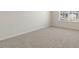 Bright bedroom with soft carpeting and a window to let in natural light at 1113 Ursa Major Ct, Wendell, NC 27591