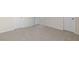 An open bedroom with plush carpeting and multiple entryways at 1113 Ursa Major Ct, Wendell, NC 27591