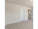 Neutral-toned bedroom features two closets and plush carpeting at 1113 Ursa Major Ct, Wendell, NC 27591