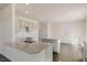 The kitchen features granite countertops, stainless steel appliances, and bright cabinetry at 1113 Ursa Major Ct, Wendell, NC 27591