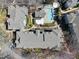 Aerial view of the community showcasing well-maintained buildings, lush landscaping, and a sparkling pool at 1121 Parkridge Ln # 207, Raleigh, NC 27605
