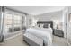 Serene bedroom with a large window, plush carpeting and neutral décor provides a relaxing atmosphere at 1121 Parkridge Ln # 207, Raleigh, NC 27605