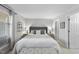 Serene main bedroom with a plush bed, soft lighting, and a calming color palette for relaxation at 1121 Parkridge Ln # 207, Raleigh, NC 27605