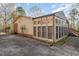 Sun room with multiple windows, providing natural light and views of the outdoors at 1122 Snow Hill Rd, Durham, NC 27712