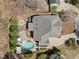 Expansive backyard featuring an in-ground pool, outdoor seating, and well-maintained landscaping at 116 Arlen Park Pl, Holly Springs, NC 27540