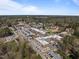 An aerial view shows a charming town with commercial areas, green spaces, and ample parking at 116 Arlen Park Pl, Holly Springs, NC 27540