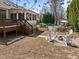 Private backyard oasis with pool, fire pit with seating, and a deck, perfect for outdoor entertaining at 116 Arlen Park Pl, Holly Springs, NC 27540