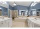Large bathroom with separate vanities, soaking tub, and stand-alone shower at 116 Arlen Park Pl, Holly Springs, NC 27540
