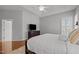 Bright bedroom features tray ceiling, plush carpet, and lots of natural light at 116 Arlen Park Pl, Holly Springs, NC 27540