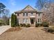 Beautiful brick home with manicured lawn and garden, complete with classic architectural design at 116 Arlen Park Pl, Holly Springs, NC 27540