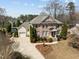 A charming two-story brick home with mature landscaping, attached garage and circular window accent at 116 Arlen Park Pl, Holly Springs, NC 27540
