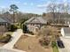 A charming two-story brick home with mature landscaping, attached garage and circular window accent at 116 Arlen Park Pl, Holly Springs, NC 27540