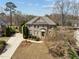Classic brick home with well-maintained lawn and landscaping, showcasing its inviting curb appeal at 116 Arlen Park Pl, Holly Springs, NC 27540