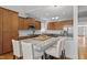 Spacious kitchen with stainless steel appliances, custom cabinets, and a granite island with seating for casual dining at 116 Arlen Park Pl, Holly Springs, NC 27540