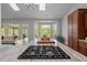 Beautiful kitchen island featuring a gas cooktop and breakfast bar, with great flow and abundant natural light at 116 Arlen Park Pl, Holly Springs, NC 27540