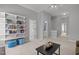 This living room features built-in shelves and a view into the bathroom from the doorway at 116 Arlen Park Pl, Holly Springs, NC 27540