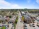 A quaint street view reveals a welcoming neighborhood with a mix of housing and commercial buildings at 116 Arlen Park Pl, Holly Springs, NC 27540