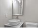 Modern bathroom featuring a vessel sink, sleek faucet, and a large mirror at 1209 Freeman Dr, Sanford, NC 27330