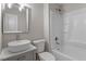 Updated bathroom featuring a modern vanity, new lighting, and bathtub-shower combination at 1209 Freeman Dr, Sanford, NC 27330