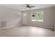 Bright living room with hardwood floors, a ceiling fan, and a view of the backyard at 1209 Freeman Dr, Sanford, NC 27330